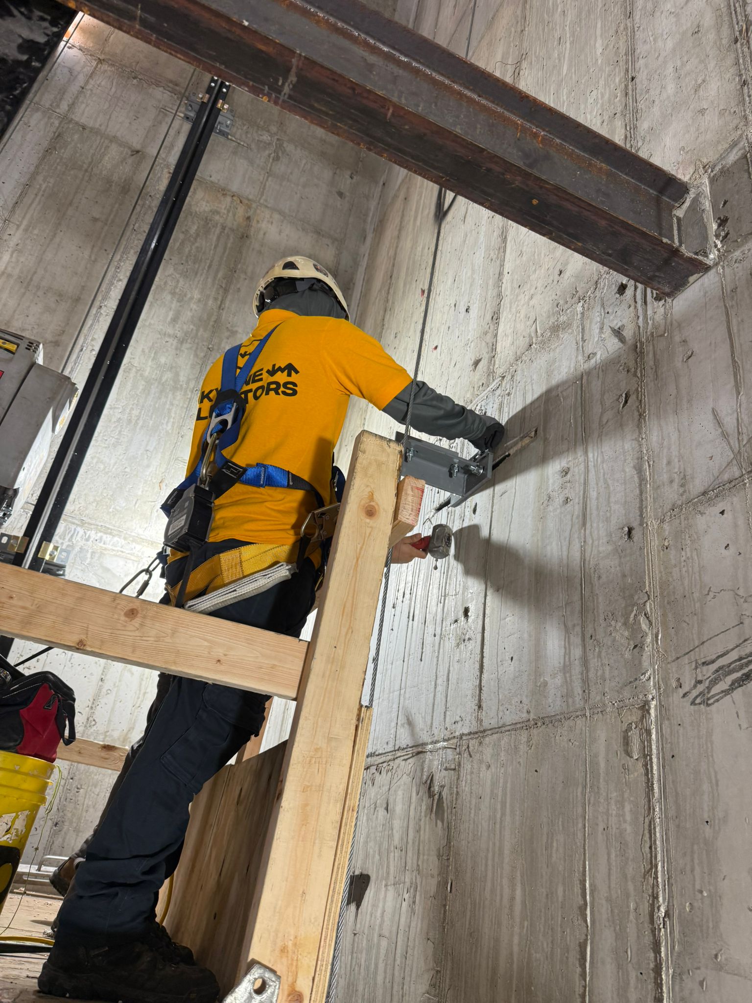 Technician in hoistway